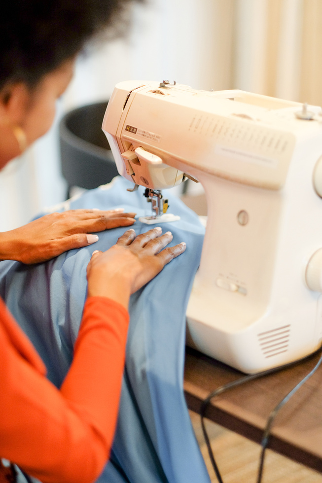 Woman Sewing a Dress